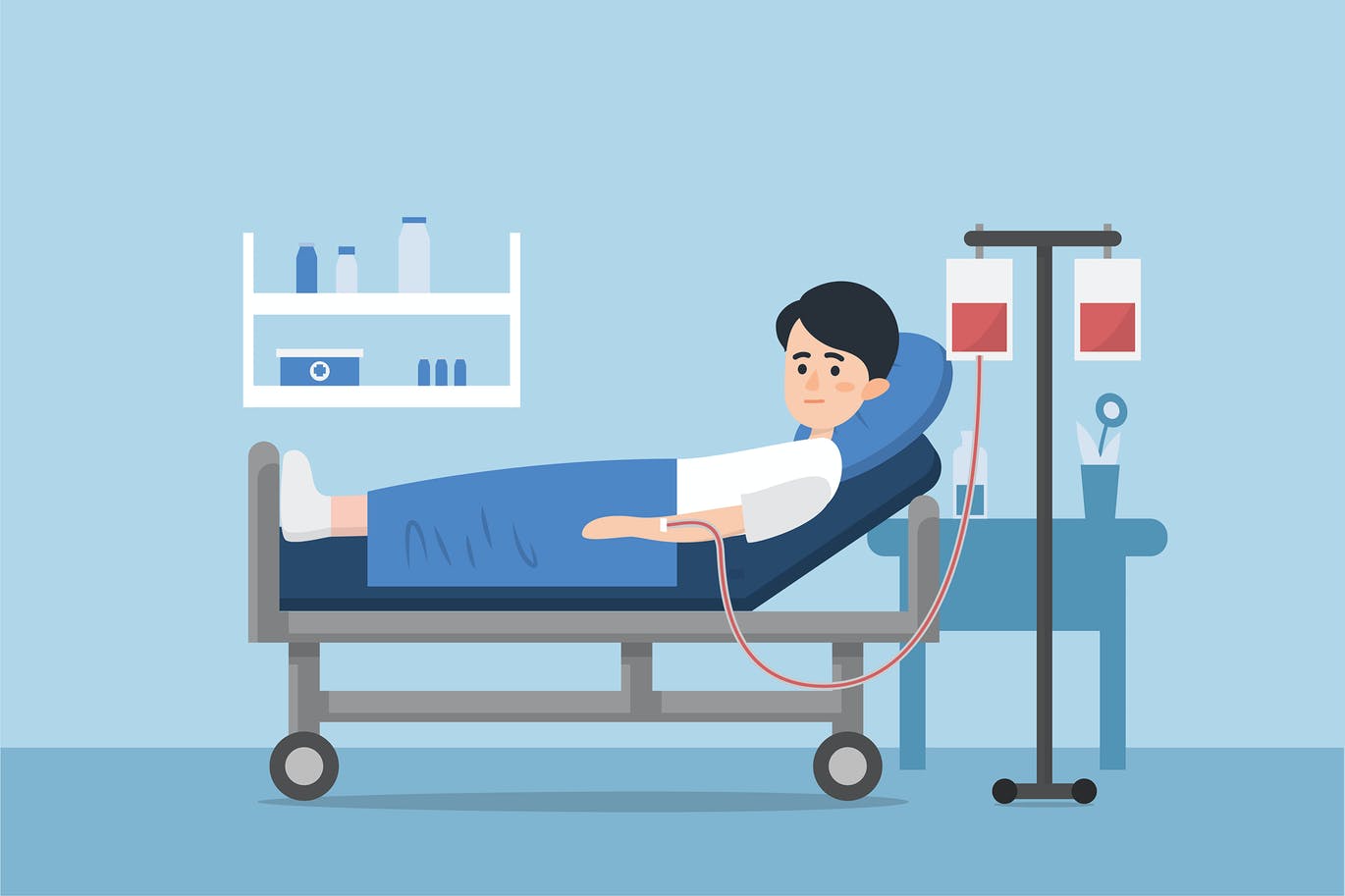 A sick person is in a medical bed on a drip