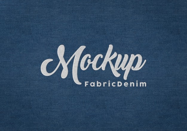 Embossed logo mockup on blue fabric texture Premium Psd