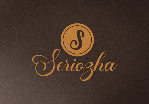 Embossed logo mockup on brown fabric texture Premium Psd