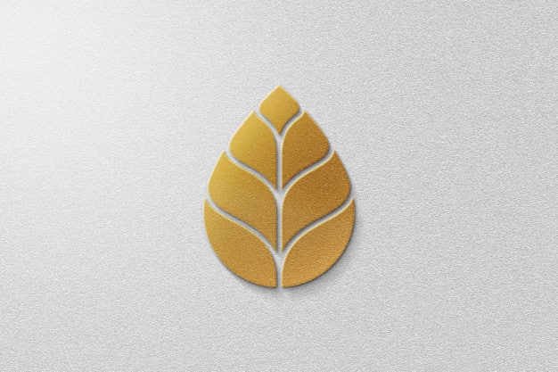Golden leaf logo mockup with white paper Premium Psd