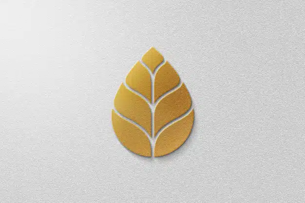 Golden leaf logo mockup with white paper Premium Psd