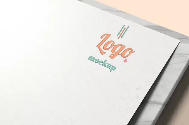 Logo mockup on white paper with marble Premium Psd