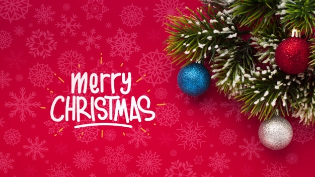 Merry christmas and pine leaves on christmas red background Free Psd