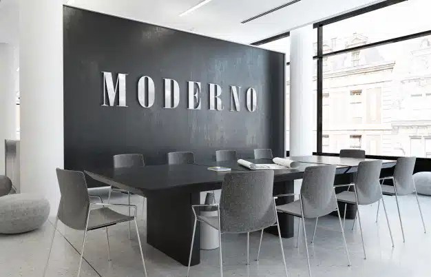 Mockup of silver 3d office logo in elegant business indoor workspace Premium Psd