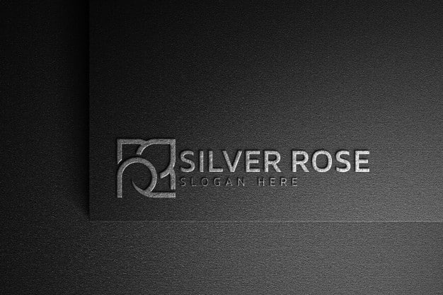 Silver rose logo mockup on dark paper Premium Psd