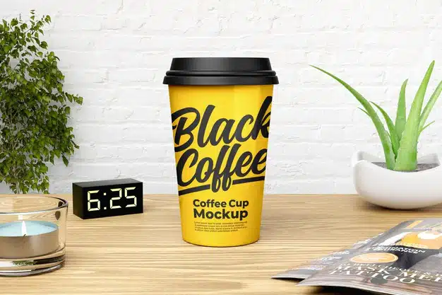 Yellow coffee cup mockup with white brick wall background Premium Psd