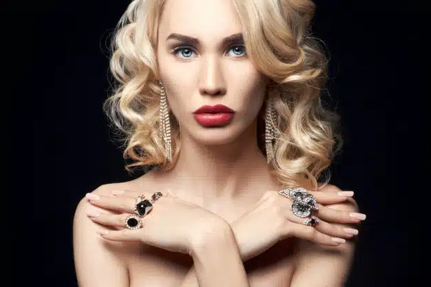 Fashion blonde woman on a dark background Premium Photo