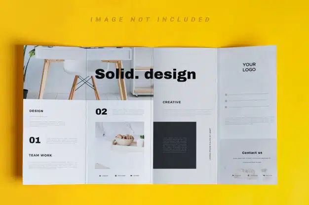 Four-fold brochure mockup over yellow table Premium Psd